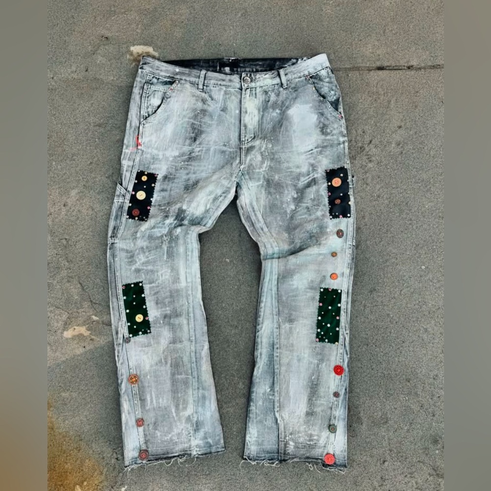 Custom painted white carpenter jeans by OGUN.NYC